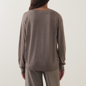 Model wearing Hugo Boss Brown Overflow 100% virgin wool knit top, shown from behind, styled with matching wide-leg trousers.