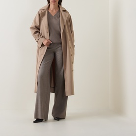Model wearing Hugo Boss Brown Overflow wool top, styled with a taupe trench coat and wide-leg trousers.