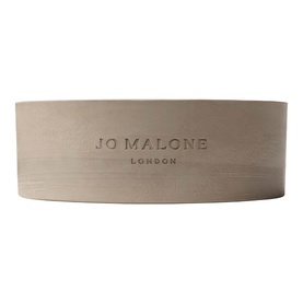Jo Malone London Lime Basil & Mandarin Outdoor Candle in pale stone-toned cylindrical vessel with embossed branding