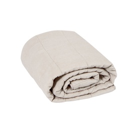 Foxford quilted blanket in soft oatmeal, neatly rolled to show textured stitched pattern and folded edge detail.