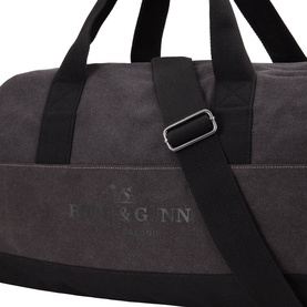 Rodd & Gunn Charcoal Onyx Hold All with black top handles, silver-tone crossbody strap and embossed logo detail