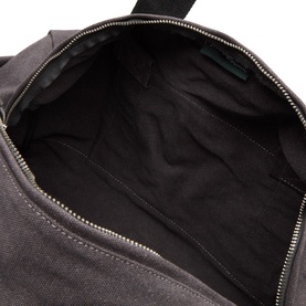Rodd & Gunn Hold All in Charcoal Onyx, interior view showing black lined main compartment with zip closure and inner pocket.