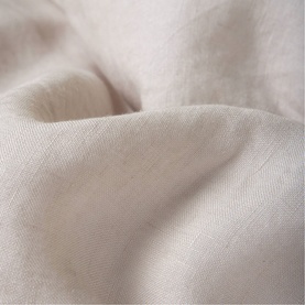 Foxford beige woven textile, close-up showing soft drape and fine weave texture in warm neutral tone.
