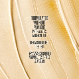 Sol De Janeiro body lotion texture swatch in golden hue, highlighting paraben-free, vegan, PETA-certified and dermatologist-tested credentials