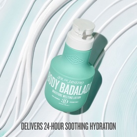 Sol De Janeiro Body Badalada Moisture Melting Lotion in teal pump bottle, shown with swirled cream texture on light blue background.