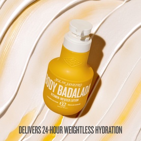Sol de Janeiro Body Badalada Vitamin-Infused Body Lotion in yellow pump bottle with cream texture swirl background