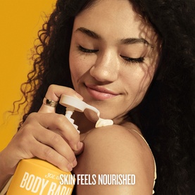 Model with Sol De Janeiro Body Balm, applying lotion to shoulder, with text overlay reading "Skin Feels Nourished