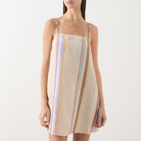 Model wearing Staud dress in Day Trip Stripe, sleeveless linen mini with square neckline and thin straps featuring multicolour vertical stripe print
