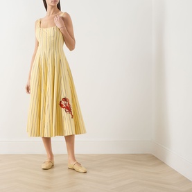 Model wearing Staud dress in Monday Stripe Lobster, yellow striped midi with lobster appliqu&eacute;, square neck, full skirt, styled with yellow mules