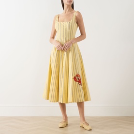 Model wearing Staud dress in Monday Stripe Lobster, yellow striped midi with lobster embroidery, square neck, full skirt, paired with yellow mules