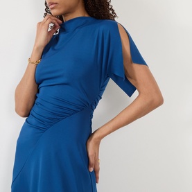 Model wearing Victoria Beckham Gathered Asymmetric Dress in Dark Ocean, featuring high slash neckline, split sleeves and gathered diagonal waist