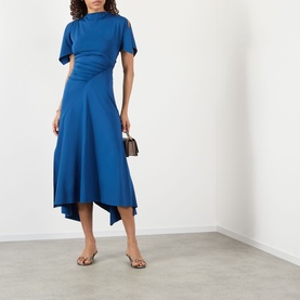 Model wearing Victoria Beckham Gathered Asymmetric Dress in Dark Ocean, featuring high neckline, short sleeves and asymmetric midi skirt. Styled with