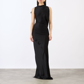 Model wearing Victoria Beckham Kyra Draped Gown in black, sleeveless with side-gathered detailing, diagonal skirt seam and floor-sweeping maxi hem