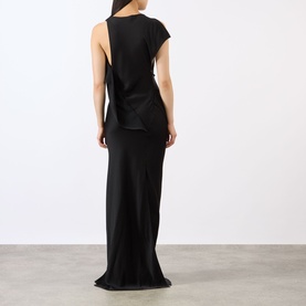 Model wearing Victoria Beckham Kyra Draped Gown in black, shown from behind, highlighting the open back, side gathering and floor-sweeping hem.