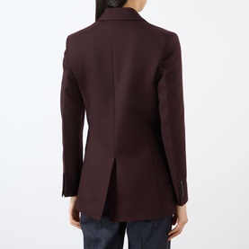 Model wearing Victoria Beckham Katherine Single-Breasted Blazer in Acai, rear view showing vent and buttoned cuffs, styled with blue jeans