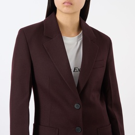 Model wearing Victoria Beckham Katherine Single-Breasted Blazer in Acai, notched lapels, front button fastening, styled with a grey logo T-shirt.