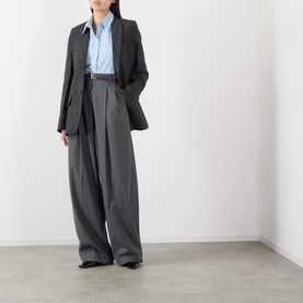 Model wearing Victoria Beckham Ore Melange jacket styled with wide-leg trousers and a light blue shirt