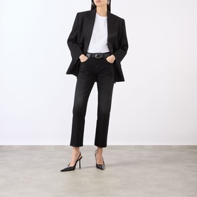 Model wearing Victoria Beckham Washed Black jeans, styled with a black blazer, white tee, and black heels.