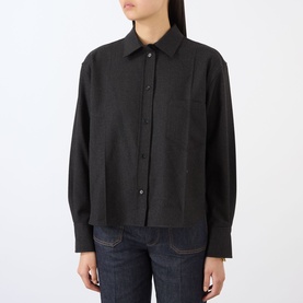 Model wearing dark charcoal cropped shirt with button-front, chest pocket and long sleeves, styled with dark denim jeans