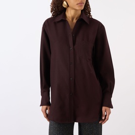 Model wearing Victoria Beckham Remi Patch Pocket Shirt in Acai, featuring pointed collar, dropped shoulders, chest pocket and button fastening.