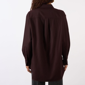 Model wearing Victoria Beckham Remi Patch Pocket Shirt in Acai, back view showing dropped shoulders, long sleeves and curved hem, styled with dark