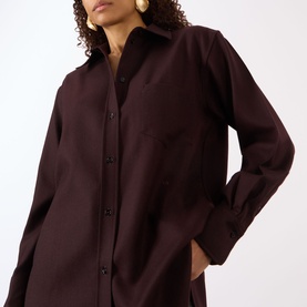 Model wearing Victoria Beckham Remi Patch Pocket Shirt in Acai, featuring pointed collar, long sleeves, dropped shoulders and chest pocket