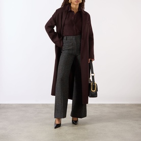 Model wearing Victoria Beckham Remi Patch Pocket Shirt in Acai, styled with a dark burgundy longline coat, grey wide-leg trousers and black heels.