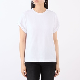 Model wearing Victoria Beckham white T-shirt with crew neck and rolled short sleeves, styled with black trousers