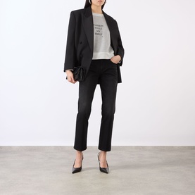 Model wearing Victoria Beckham grey marl top with black blazer, cropped dark jeans and black pointed heels.