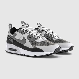 Nike Air Max 90 trainers in vast grey and pencil point, featuring mesh upper, grey swoosh, and white midsole with black outsole