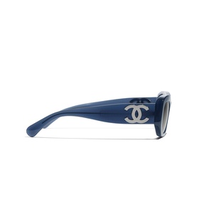 Chanel sunglasses in blue, side profile showing silver CC logo on temple and gradient lens detail