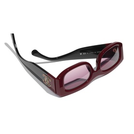 Chanel red rectangular sunglasses with gold CC logo on temple, pink-tinted lenses and black arms