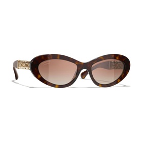 Tortoiseshell oval sunglasses with gold-tone chain temple detail and gradient brown lenses