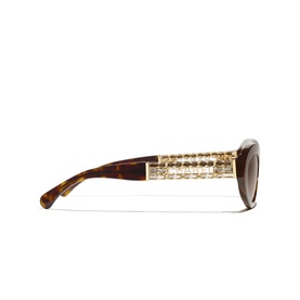 Chanel oval sunglasses in tortoiseshell with gold tweed-effect embellished temples and brown gradient lenses