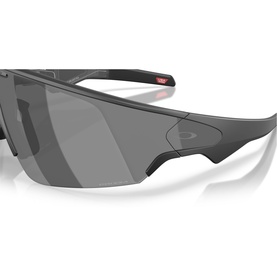 Oakley black wraparound sunglasses with dark tinted lens, semi-rimless frame design and red accent detail on temple.