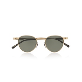 Round sunglasses with gold metal frames, dark green lenses, and black temple tips, shot against white background