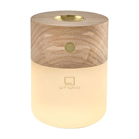 Gingko smart diffuser lamp in light wood finish with warm glowing frosted glass base and gold-toned top detail