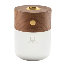 Gingko lamp with white base, walnut wood top, gold button detail and open top candle holder recess