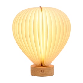Gingko hot air balloon-shaped table lamp with cream ribbed paper shade and natural wood circular base, illuminated warm white