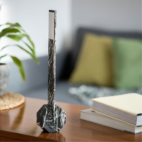 Gingko Black Marble slim table lamp with marble base, styled on a wooden surface in a living room setting
