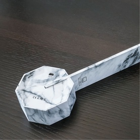 Gingko White Marble desk light with hexagonal base, shown at an angle on a dark wood surface
