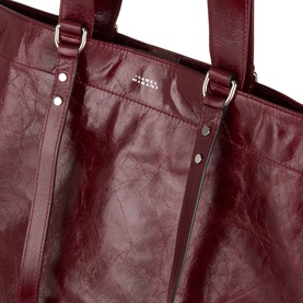Isabel Marant Winna Tote Bag in burgundy leather, close-up showing silver-tone hardware, carry handles and foil logo lettering