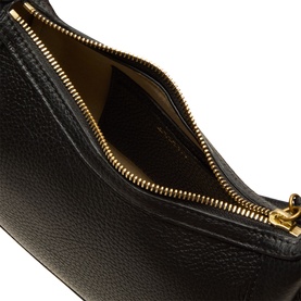 Isabel Marant black pebbled leather shoulder bag, open view showing gold-tone zip and tan interior lining.