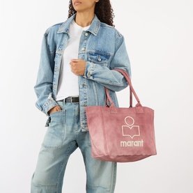 Model carrying Isabel Marant Yenky Logo Small Zip Tote Bag in raspberry canvas with embroidered logo, styled with denim jacket and jeans