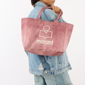 Model carrying Isabel Marant Yenky Logo Small Zip Tote Bag in raspberry canvas with embroidered logo, styled with a denim jacket