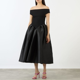 Model wearing Marques Almeida Mikado Princess Dress in black, off-the-shoulder, fitted bodice with puff midi skirt. Styled with pink heeled mules.