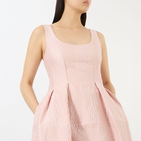 Model wearing Marques Almeida Pink Textured Brocade Dress with scoop neckline, sleeveless fit and pleated brocade bodice detail