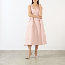 Model wearing Marques Almeida Pink Textured Brocade Dress; scoop neck, sleeveless, pleated midi skirt, styled with silver heeled mules