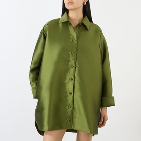 Model wearing Marques Almeida Heavy Fluid Shirt in khaki, featuring pointed collar, long sleeves, turned-up cuffs and longline satin silhouette