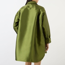 Model wearing Marques Almeida Heavy Fluid Shirt in khaki, rear view showing longline silhouette, turned-up cuffs and heavyweight satin fabric.